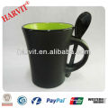 colored ceramic coffee mug with spoon